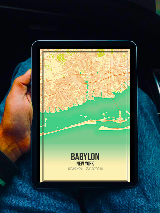 Man looking at tablet that shows a map of babylon, ny.